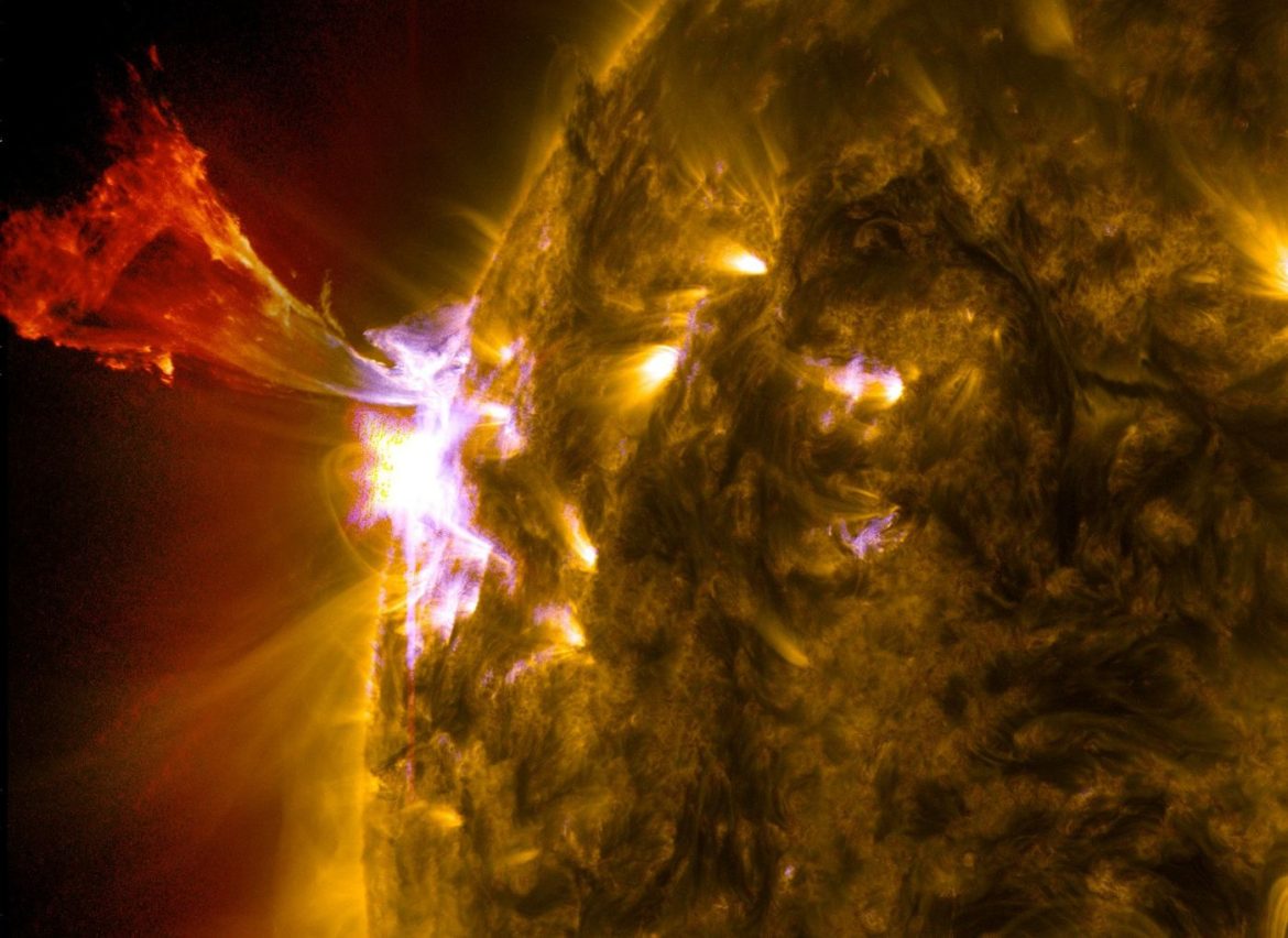 the Sun imaged by a space telescope with a bright flare at its limb